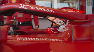 Ferrari race car sporting DXC logo - The future of driving in a human-machine world | DXC Technology Insights - Leading the future of driving in a human-machine world | DXC Technology Insights 